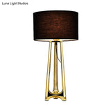 Modern Metal Tripod Table Light With Black Drum Fabric Shade Gold Finish