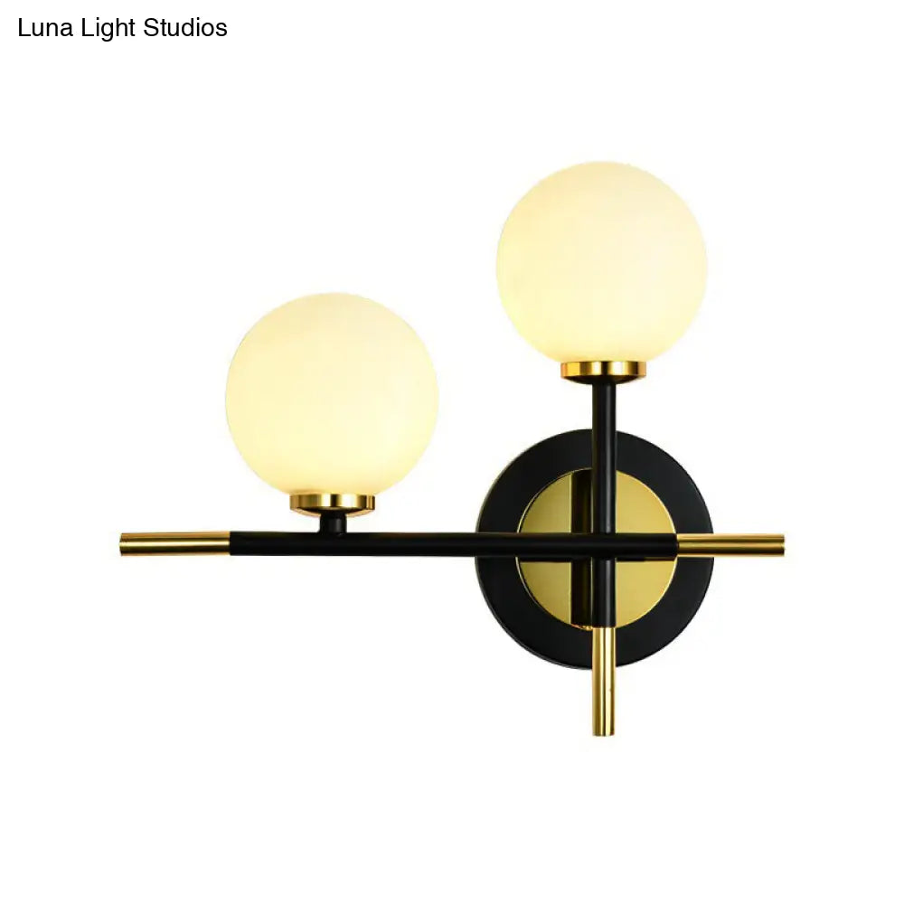 Modern Milk Glass Orb Sconce Wall Light - 2 Lights Black And Brass Cross Design