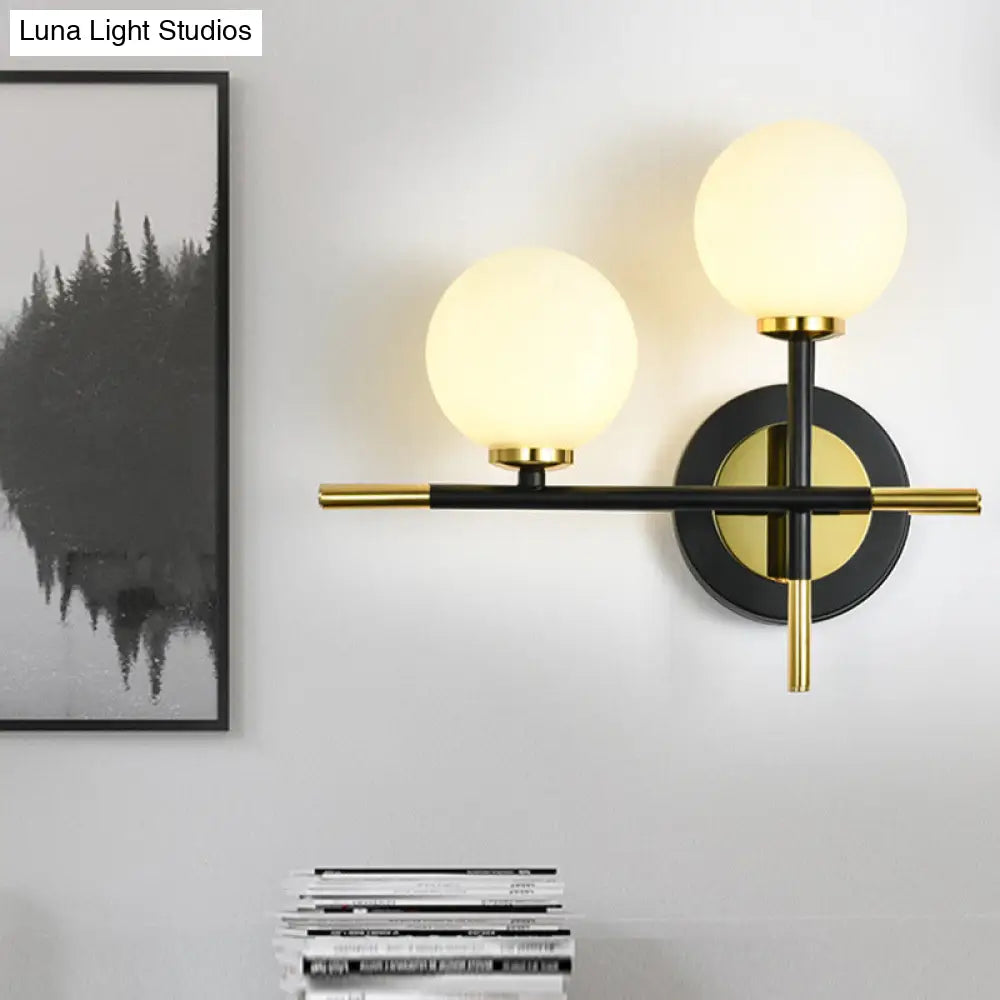 Modern Milk Glass Orb Sconce Wall Light - 2 Lights Black And Brass Cross Design
