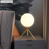 Modern Opal Glass Sphere Desk Lamp With Metal Tripod In Gold/Black
