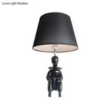 Modern Resin Sitting People Desk Lamp With Tapered Shade - 1 Bulb Light For Kitchen