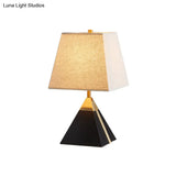 Modern Trapezoid Night Table Lamp In White/Flaxen - Light Fabric Sleek Design With Black Pyramid