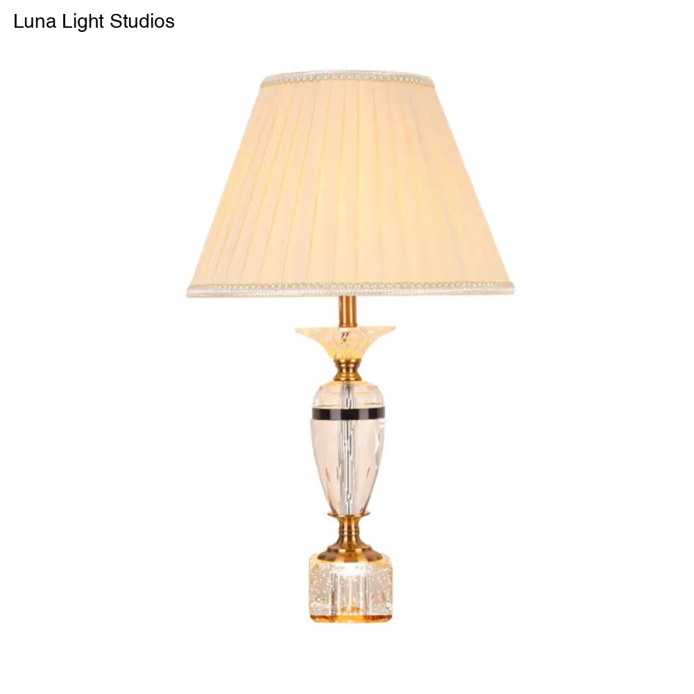 Modern Urn Shape Fabric Desk Light - Faceted Crystal 1 Bulb Night Table Lamp In Beige