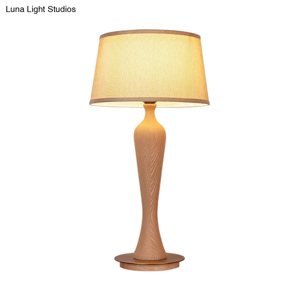 Modern Urn-Shaped Wood Desk Lamp In Beige - 1 Bulb Table Light With Drum Fabric Shade