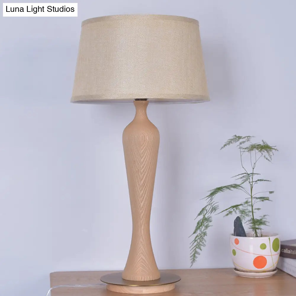 Modern Urn-Shaped Wood Desk Lamp In Beige - 1 Bulb Table Light With Drum Fabric Shade