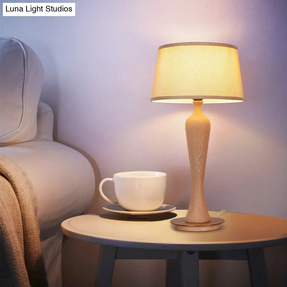 Modern Urn-Shaped Wood Desk Lamp In Beige - 1 Bulb Table Light With Drum Fabric Shade