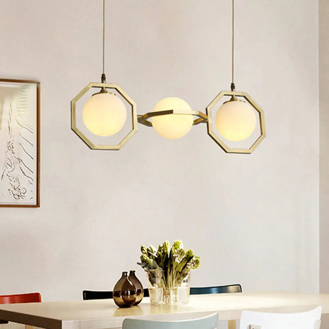 Modern White Frosted Glass Orb Island Light With Gold Octagon Frame - 3-Light Ceiling Pendant Lamp