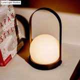 Modern White Glass Night Table Lamp With Metal Handle - Globe Task Light Design