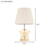 Modern Wood Star Nightstand Lamp With Beige Barrel Fabric Shade