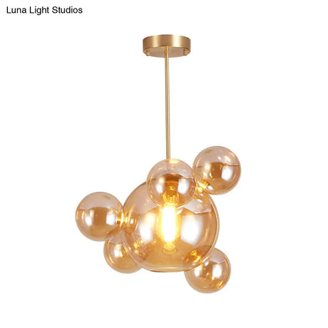 Modernist Amber Glass Pendant Lamp For Dining Table - 1 Light Bubble Shape Hanging Kit