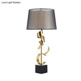 Modernist Barrel Table Light: 1-Head Bedroom Nightstand Lamp In Black And Gold With Silk Ribbon Deco