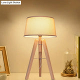 Modernist Fabric Tapered Desk Lamp With Wood Tripod - 1 Bulb Night Table Light In Brown/Beige