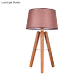 Modernist Fabric Tapered Desk Lamp With Wood Tripod - 1 Bulb Night Table Light In Brown/Beige