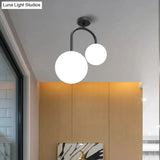Modernist Milk Glass Ceiling Light Fixture - Semi Flush Mount With 2 Spherical Heads In Elegant