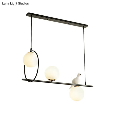 Modernist Milk Glass Pendant Lamp With 3 Globe Heads And Bird Accent - Black Finish