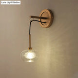 Modernist Oval Amber/White Glass Sconce With Brass Finish - Wall Mounted 1-Light Drop Lamp Amber