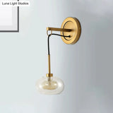 Modernist Oval Amber/White Glass Sconce With Brass Finish - Wall Mounted 1-Light Drop Lamp