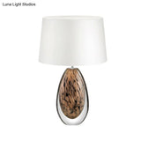 Modernist White Fabric Desk Lamp With Teardrop Brown Glazed Crystal Base - 1 Head Tapered Table