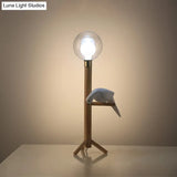 Modernist Wood Table Lamp With Clear Glass Sphere Night Light And Bird Decoled