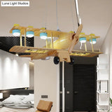 Nordic Beige Wood Pendant Light: Glider Shaped Hanging Light For Kindergarten