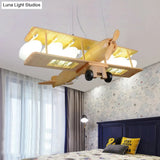 Nordic Beige Wood Pendant Light: Glider Shaped Hanging Light For Kindergarten