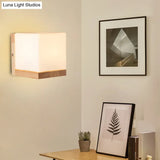 Nordic Style Cube Shaped Sconce Lighting With White Glass Shade - 1-Light Bedside Wall Fixture