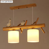 Nordic Wood Pendant Light With Opal Glass Cylinder And Resin Bird Decor