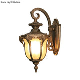 Outdoor Acorn Sconce Light Fixture With Swirl Arm And White Glass - Black/Brass Finish Wall Lamp