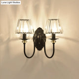 Post-Modern Black Metal Wall Mount Light With Clear Crystal Shade - Trapezoid/Flower/Drum Design