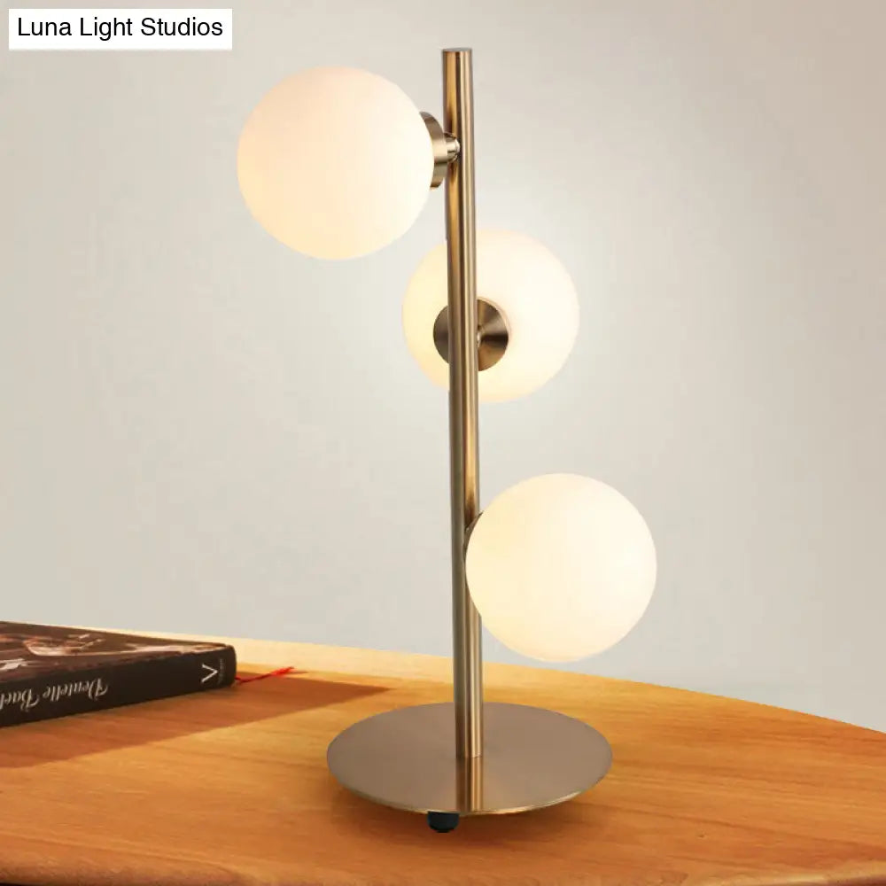 Post-Modern Gold Table Lamp Set With Globe White Glass Shades - Of 3 Lights