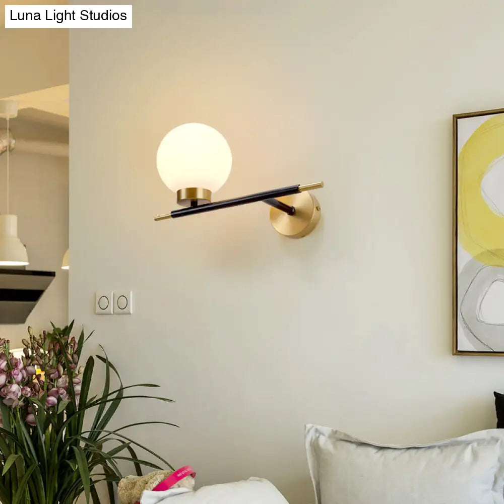 Post-Modern White Glass Sphere Wall Sconce With Brass Finish - 1/2 Bulbs