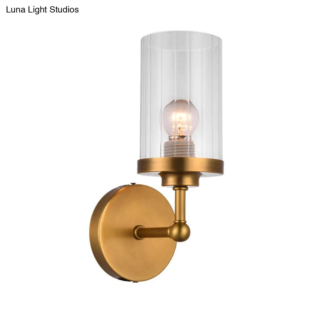 Postmodern 1-Head Brass Cylinder Wall Lighting With Clear Ribbed Glass Mount