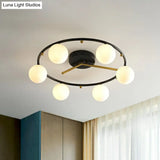 Postmodern Black & Brass 6-Head Ball Glass Ceiling Lamp: Stylish Semi Flush Mount Light
