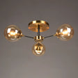 Postmodern Brass Flush Mount Light With Burst Design And Glass Ball For Living Room 3 / Amber