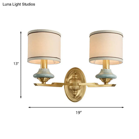 Retro Gold Fabric Wall Sconce With Porcelain Cap - Cylindrical 1/2-Light Lamp For Porch