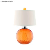Retro Orange Sphere Glass Table Lamp With Fabric Barrel Shade - 1-Bulb Bedroom Light