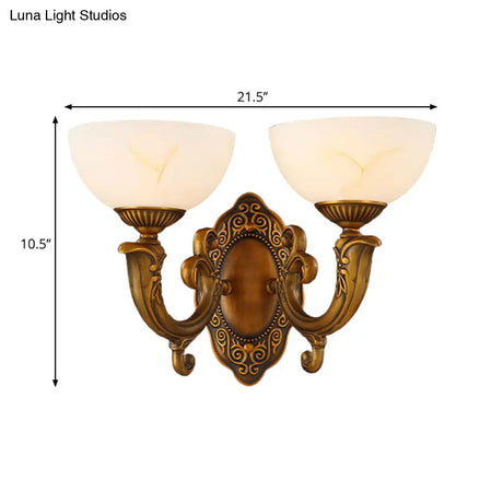 Rustic Brass Wall Sconce With Frosted Glass Shade - Swooping Arm Design For Ambient Lighting