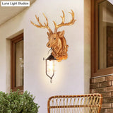 Rustic Elk Head Wall Sconce With Cage - 1-Light Courtyard Lamp Fixture In Brown Resin