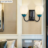 Rustic Globe Half-Wall Light With Blue Opal Glass And Curved Arm