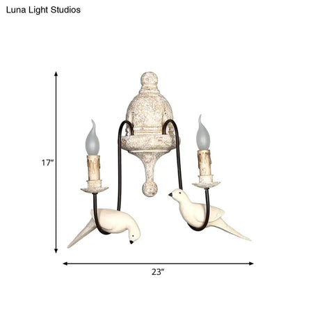 Rustic Wood Swooping Arm Wall Lamp With Distressed White Sconce - Decorative Candle And Bird Accents