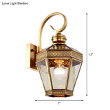 Sleek 1-Light Outdoor Brass Wall Sconce With Clear Glass Lantern Shade