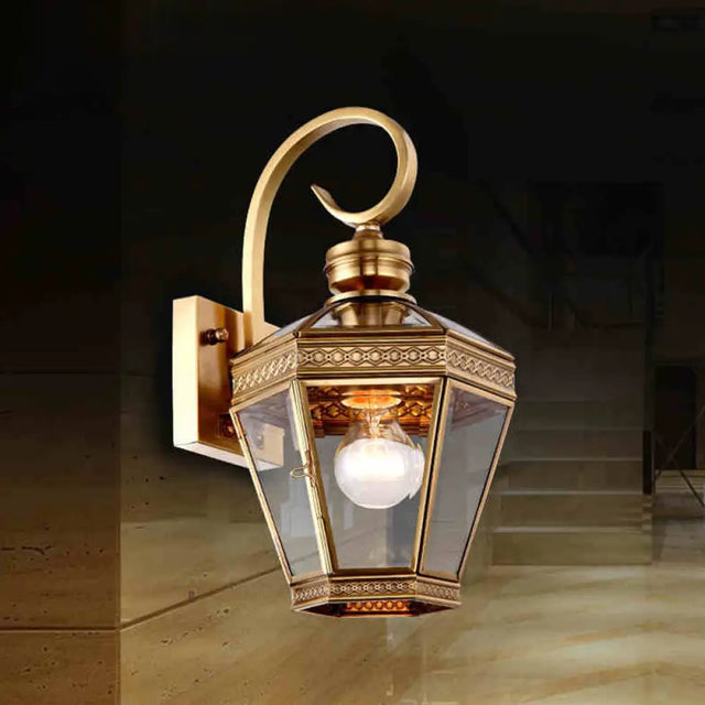 Sleek 1-Light Outdoor Brass Wall Sconce With Clear Glass Lantern Shade