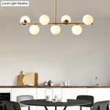 Sleek Cream Glass Spherical Dining Room Pendant Light With 7 Gold Heads - Postmodern Island Lamp