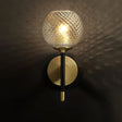 Sleek Glass Globe Wall Sconce: Ribbed Simplicity Brass Finish Mounted Light Fixture