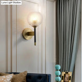 Sleek Glass Globe Wall Sconce: Ribbed Simplicity Brass Finish Mounted Light Fixture