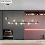 Sleek Glass Pendant Light For Dining Room With Hanging Island Design