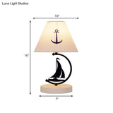 Sleek Mediterranean Metal Bedside Lamp In Black With White Fabric Shade