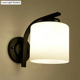 Sleek White Glass Wall Sconce With Black Accents For Living Room