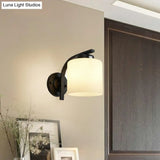 Sleek White Glass Wall Sconce With Black Accents For Living Room