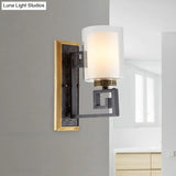 Traditional Antiqued Gold/Black Sconce With Dual Shade Pillar - Wall Mounted Light